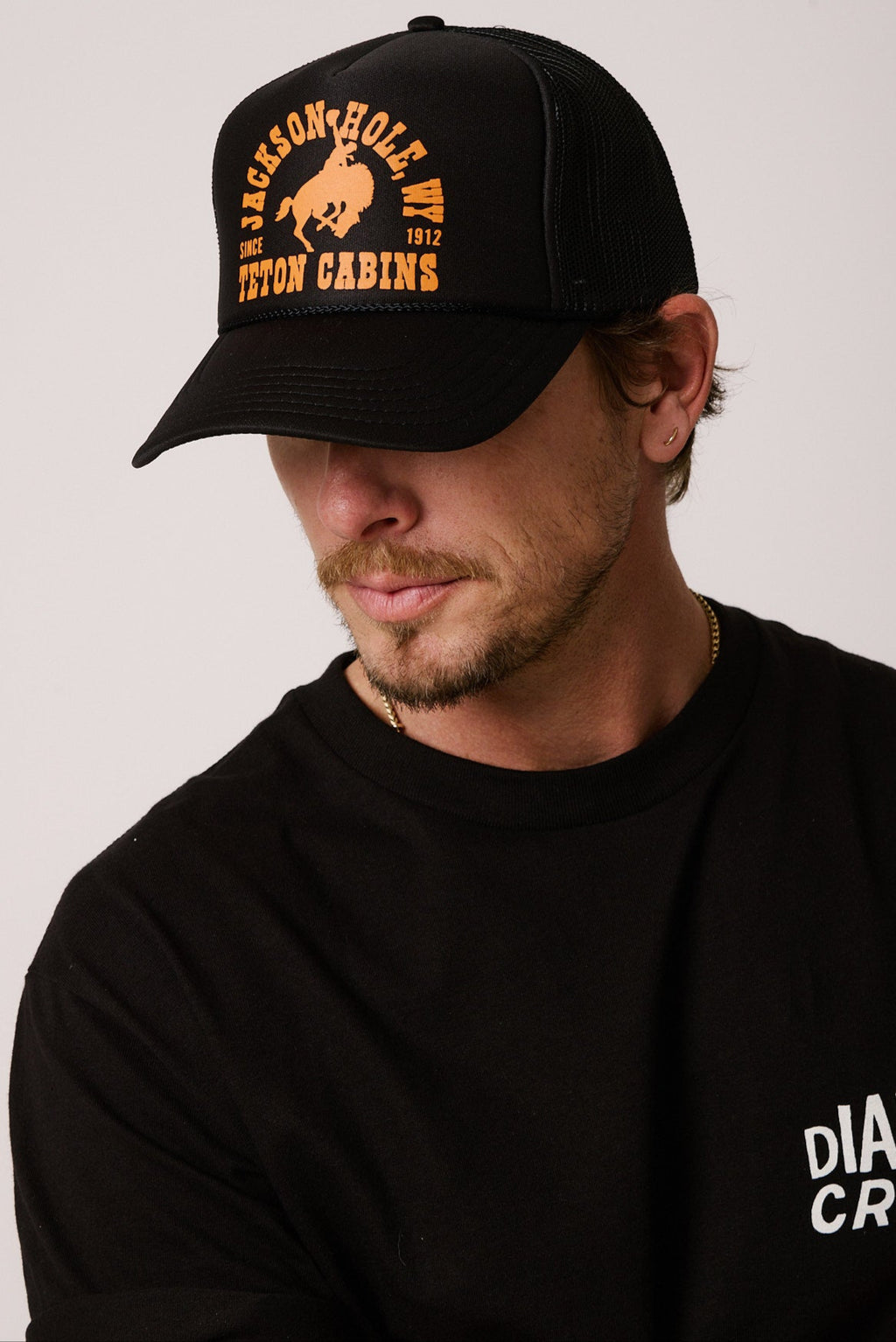 Black + Orange | Diamond cross ranch Buckin Trucker hat