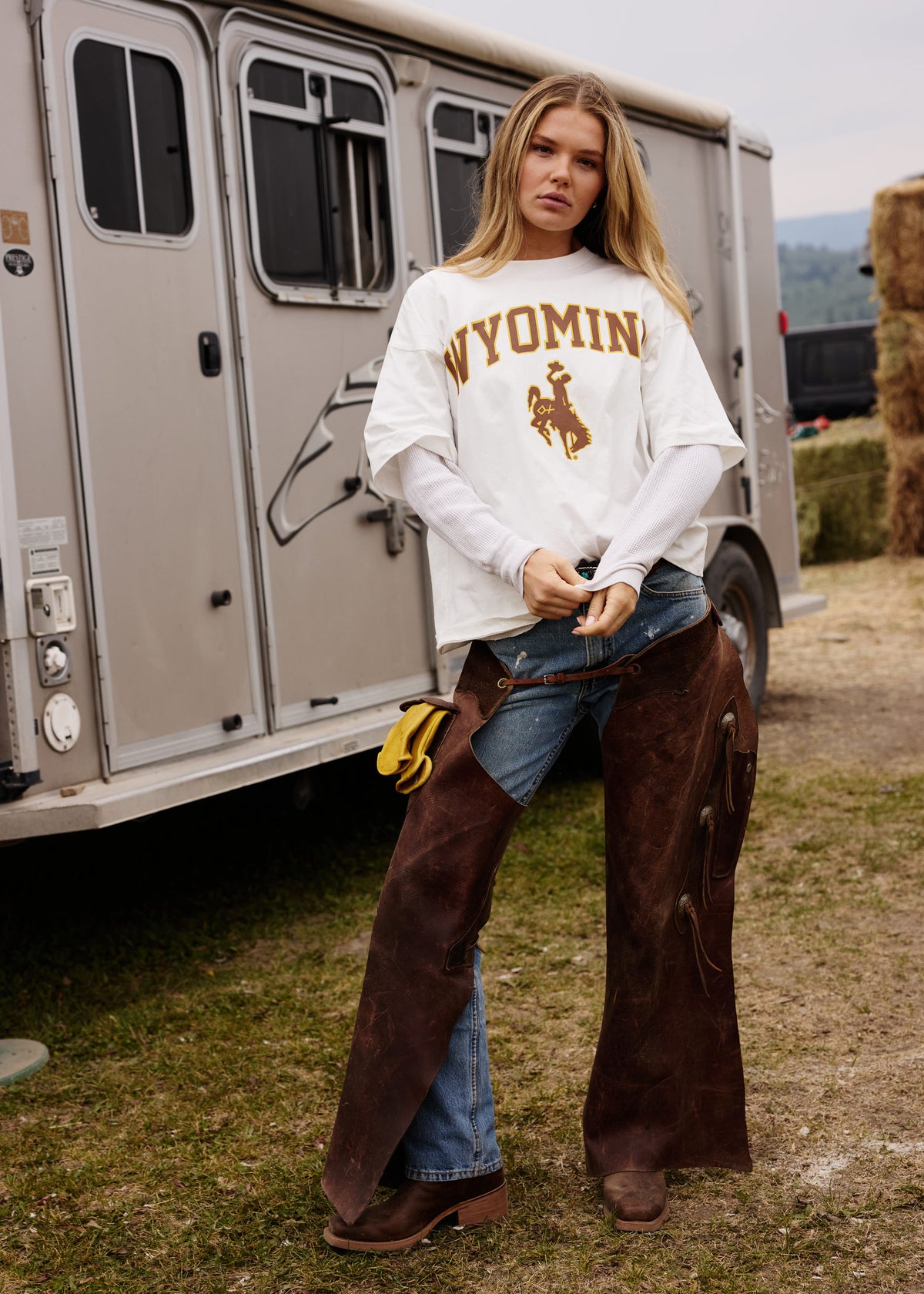 White | White t-shirt with 'Wyoming' and a logo on a concrete floor
