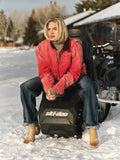 Faded Red | Person sitting on a Ski-Doo snowmobile in a snowy outdoor setting