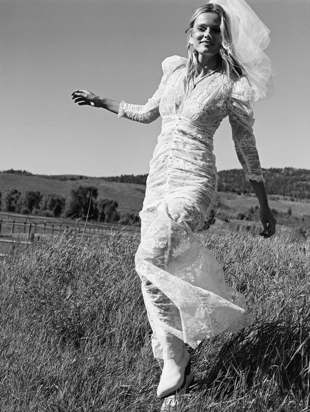Bride walking through the meadow
