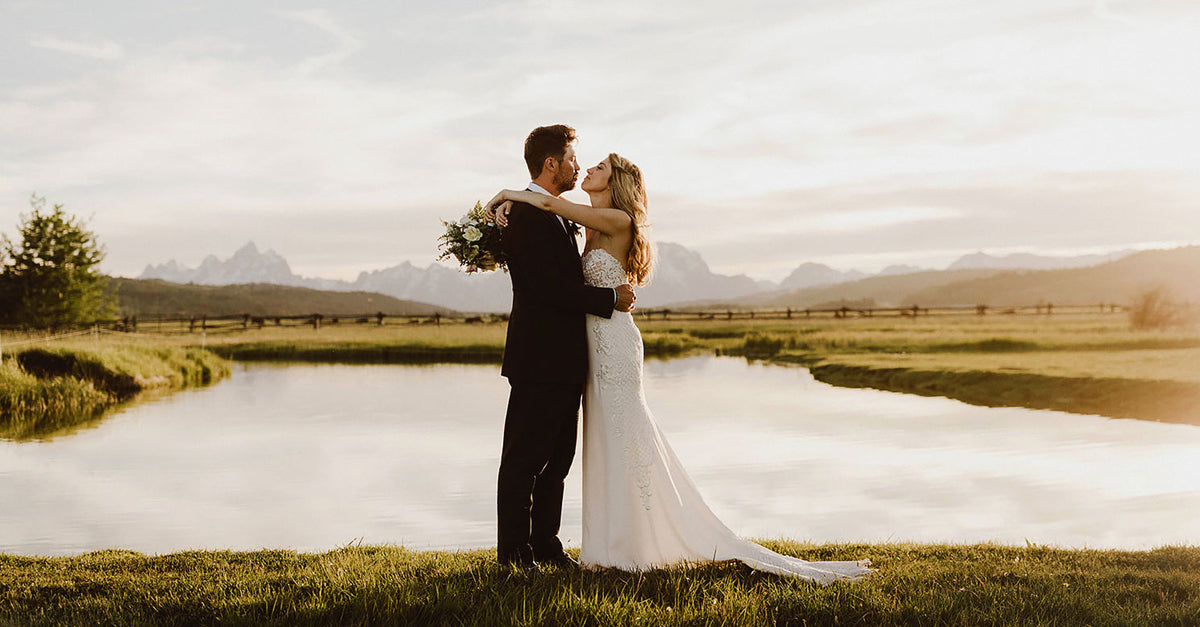 Couple at the pond with the Tetons behind, Diamond Cross Ranch